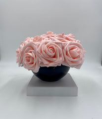 A pair of Pink Rose Bowls , black ceramic containers