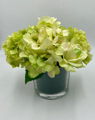 green roses and hydrangea vase