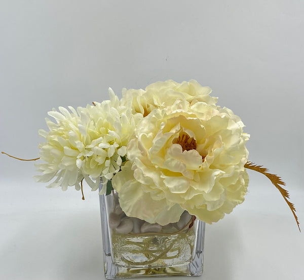 Variety vase of mixed neutral flowers